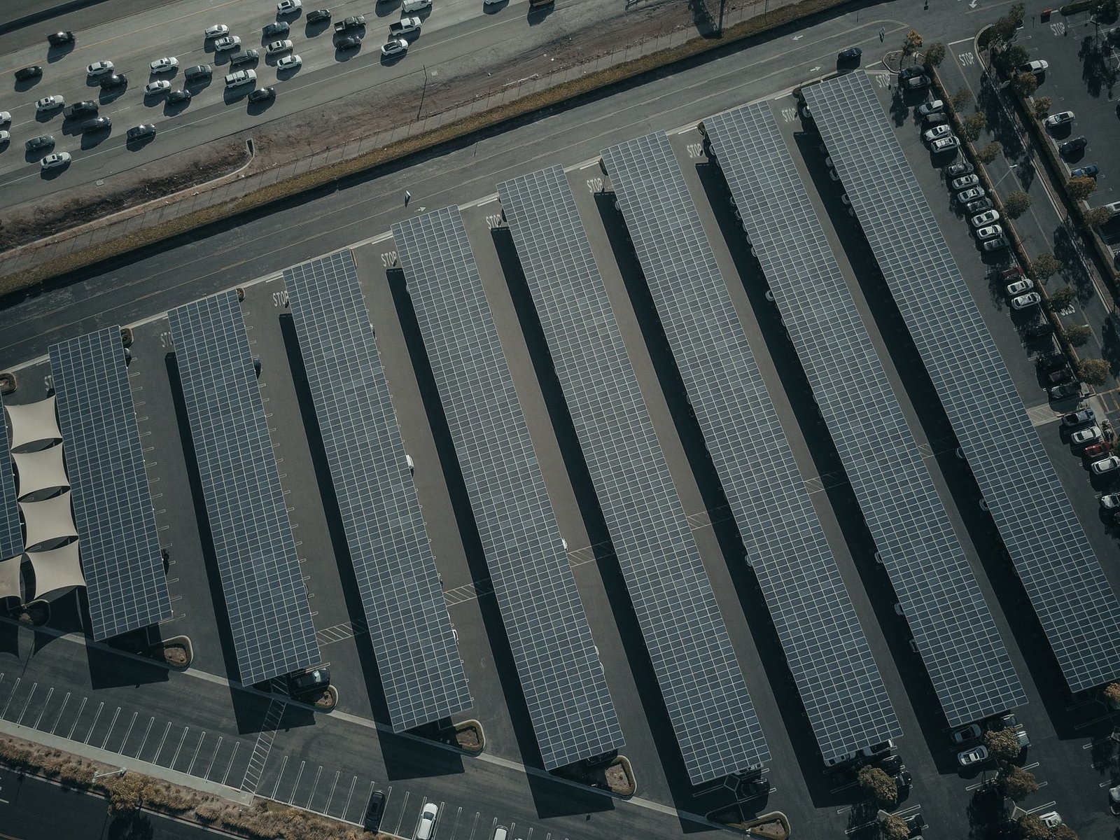 Aerial view of a solar panel array under bright sun